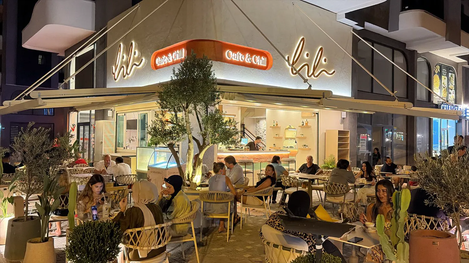 Lili Cafe & Chill storefront glowing at night